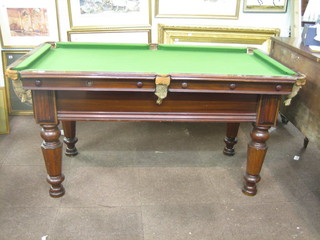 A slate based quarter size billiard table, raised on 4 turned chamfered mahogany feet 65" x 36"