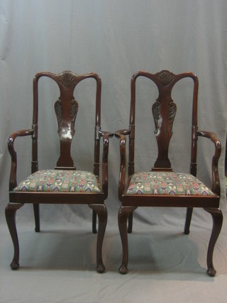 A pair of mahogany Queen Anne style splat back carver chairs with drop in seats, raised on cabriole supports