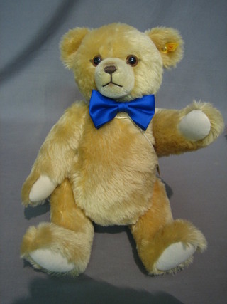 A modern yellow Steiff teddybear with articulated limbs, complete with growl 18"