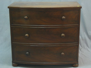 A 19th Century mahogany bow front chest of 4 long drawers with tore handles, raised on bracket feet 37"