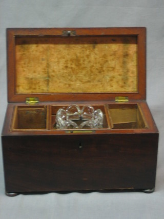 A Victorian rectangular mahogany twin compartment tea caddy with hinged lid, raised on bun feet 11"
