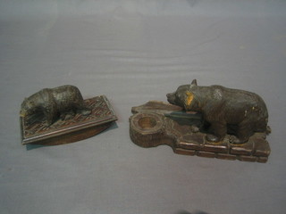 A carved Swiss desk blotter the finial in the form of a bear 5" and a ditto inkwell in the form of a walking bear 8" (both f)
