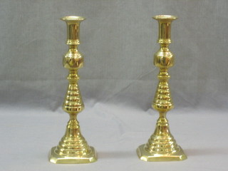 A pair of 19th Century brass candlesticks with lopped stems 11"