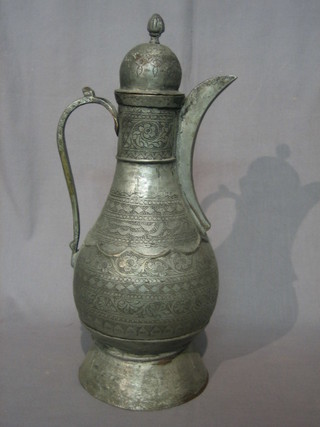 An Eastern engraved metal jug 17"