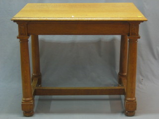 A Victorian rectangular honey oak library table, raised on a turned column and block supports with H framed stretcher 36"