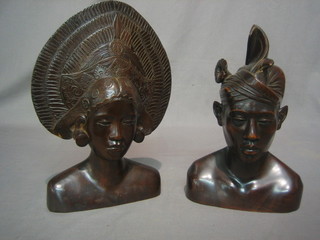 A pair of Eastern carved hardwood head and shoulder busts of a lady and gentleman 12"