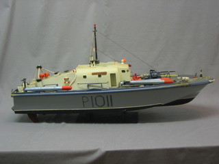 A wooden model of a patrol boat 37"