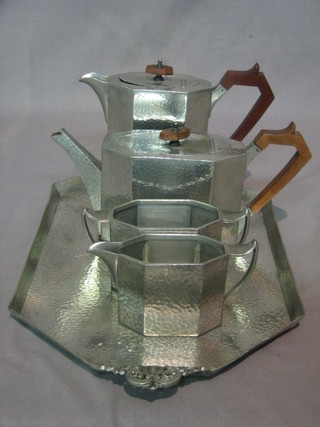 An Art Deco 4 piece craftsman tea service comprising hotwater jug, teapot, sugar bowl and cream jug together with a matching tray