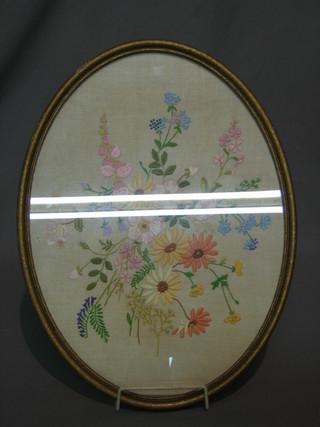 A 1930's oval embroidered panel decorated flowers 16"