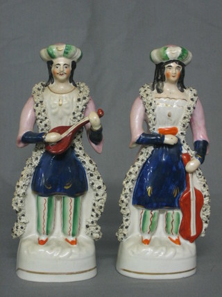 A pair of Staffordshire figure Persian lady and gentleman musicians 8"
