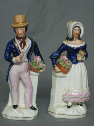 A pair of Staffordshire figures standing lady and gentleman 8" (r)