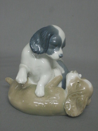 A Nao figure of 2 playing puppies 6"