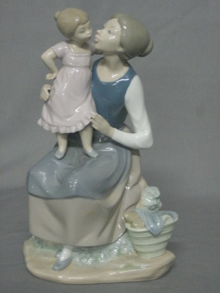 A Nao figure of a seated mother and child 9"