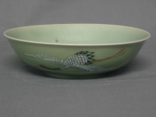 A 19th Century Celadon bowl decorated herons in flight, the base with red seal mark 8"