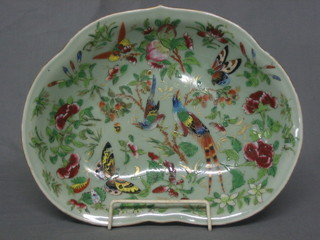 A famille vert kidney shaped bowl decorated birds amidst  branches 11"