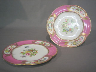 A pair of Victorian circular porcelain plates with puce and gilt banding and floral decoration 10"
