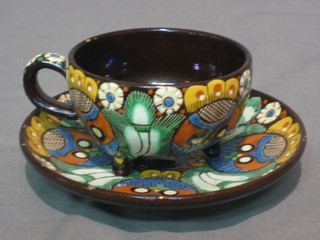 A Swiss pottery cup and saucer 4"