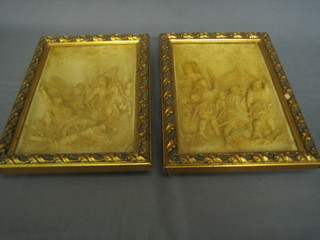 A pair of pottery relief plaques depicting battle scenes 10" x 7 1/2" contained in gilt frames