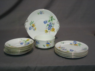 A 20 piece Royal Doulton floral pattern tea service comprising circular twin handled plate 9", 6 plates 7" (3 cracked), sugar bowl, 6 cups and 6 saucers
