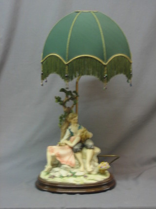 A Capo di Monte table lamp in the form of a seated couple 13"
