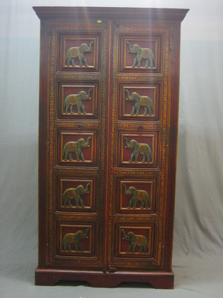 An Eastern painted hardwood cabinet, the interior fitted shelves enclosed by panelled doors painted elephants 39"