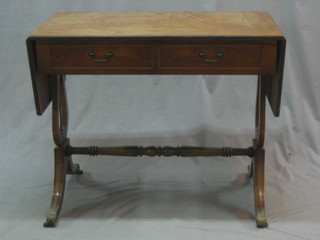 A Regency style figured walnut sofa table, fitted 2 frieze drawers and raised on lyre supports 35"