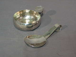 A hammered "silver" boal and a hammered silver spoon