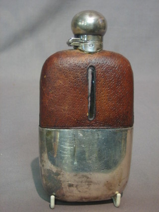 A Victorian glass hip flask with silver plated detachable cup