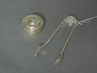 A pair of silver plated sugar tongs, a shoe horn and a silver rouge pot
