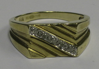 A gentleman's 9ct gold square signet ring set a diagonal line of diamonds