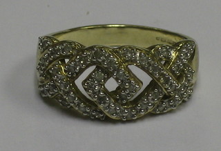 A lady's 9ct pierced gold dress ring set numerous diamonds