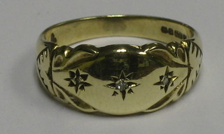 An Edwardian 9ct gold dress ring set 3 small diamonds