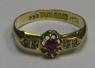 A lady's 18ct gold dress ring set an oval cut ruby supported by 4 diamonds
