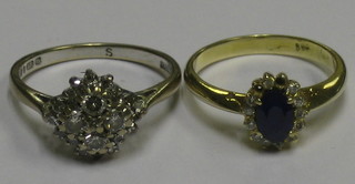 A lady's 18ct white gold cluster ring together with a gold dress ring inset sapphires and diamonds (1 stone missing)