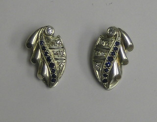 A pair of white gold ear clips set 5 diamonds and 8 sapphires the reverse marked Reklau