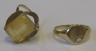 A gentleman's 9ct gold signet ring set a small diamond and a 9ct gold dress ring set a smoky quartz (2)