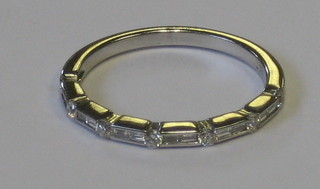 A lady's 18ct half eternity ring set baguette cut diamonds