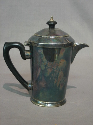 A circular silver plated hotwater jug