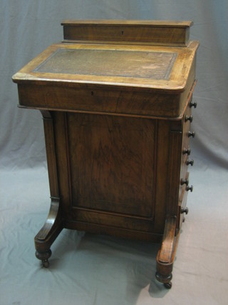 A Victorian inlaid walnut Davenport with hinged stationery box to the top, the pedestal fitted 4 long drawers 21"