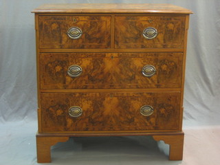 A Queen Anne style walnut chest with feather crossbanded top fitted 2 short and 2 long drawers, raised on bracket feet 35"