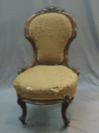 A Victorian carved walnut spoon back chair with upholstered seat, raised on cabriole supports