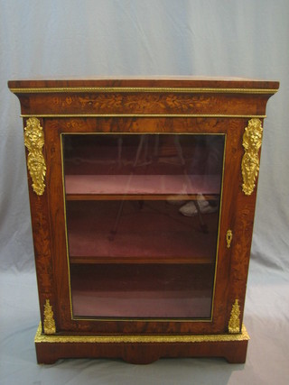 A Victorian inlaid figured walnut Pier cabinet fitted adjustable shelves enclosed by glazed panelled doors with gilt metal mounts throughout, 32"