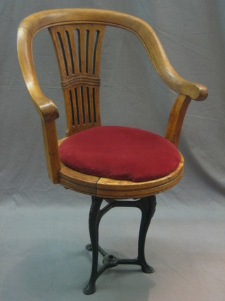 An oak and iron framed ships, tub back dining chair