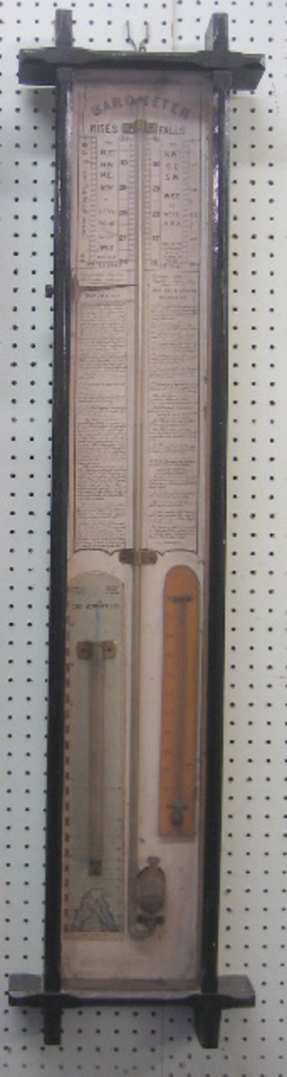 A Victorian Fitzroy barometer with paper dial (slight tear to top), storm glass (empty) contained in an ebonised Cambridge frame