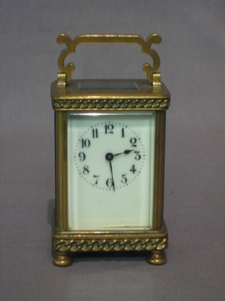 A 19th Century French carriage clock contained in a square brass case 3"