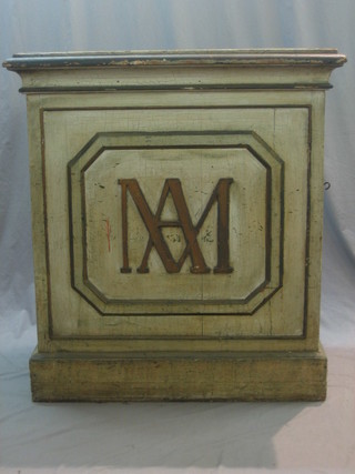 A 19th Century Continental white painted pine pedestal cupboard with panelled doors to the side, the front monogrammed AM 39"