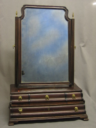 An 18th Century arched plate dressing table mirror contained in a mahogany swing frame, the stepped base fitted 3 short and 1 long drawer, raised on ogee bracket feet 18"
