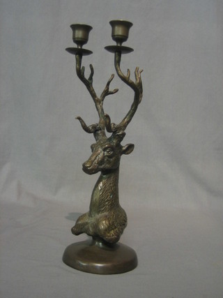 A modern bronze twin light candelabrum supported by a stags head 15"