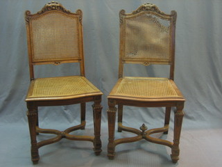 A set of 8 19th Century French carved walnut dining chairs with caned seats and backs
