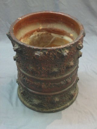 A terracotta jardiniere in the form of a stylised tree stump 16"